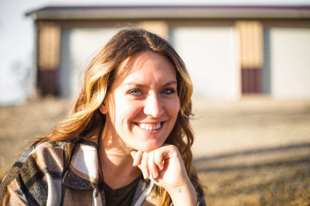 Sam Highsmith, photographer, posing for headshot