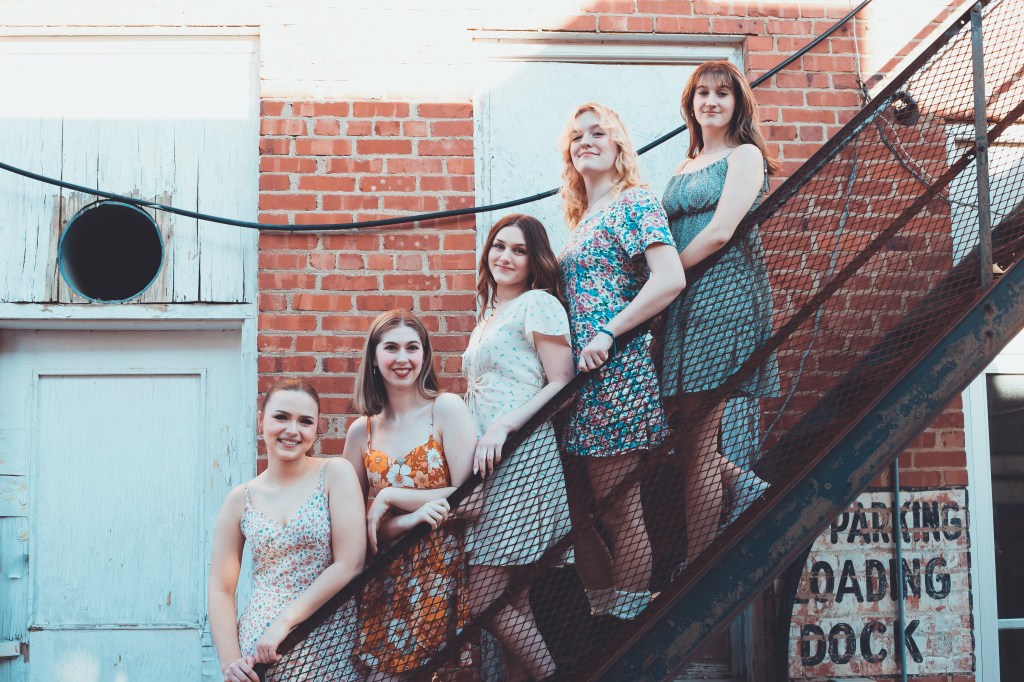 Five girls on staircase during photography session