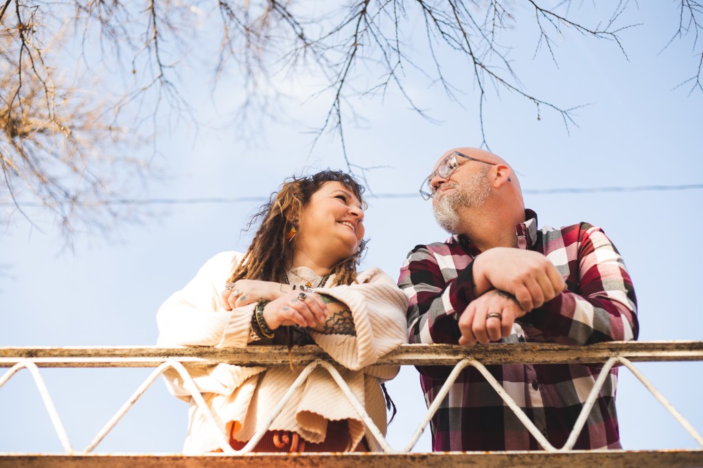 Couple being photographed from below by Sam Highmith
