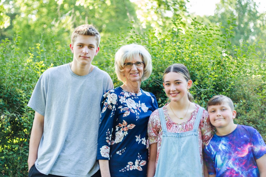 Grandma and grandkids being photographed during mini photography session
