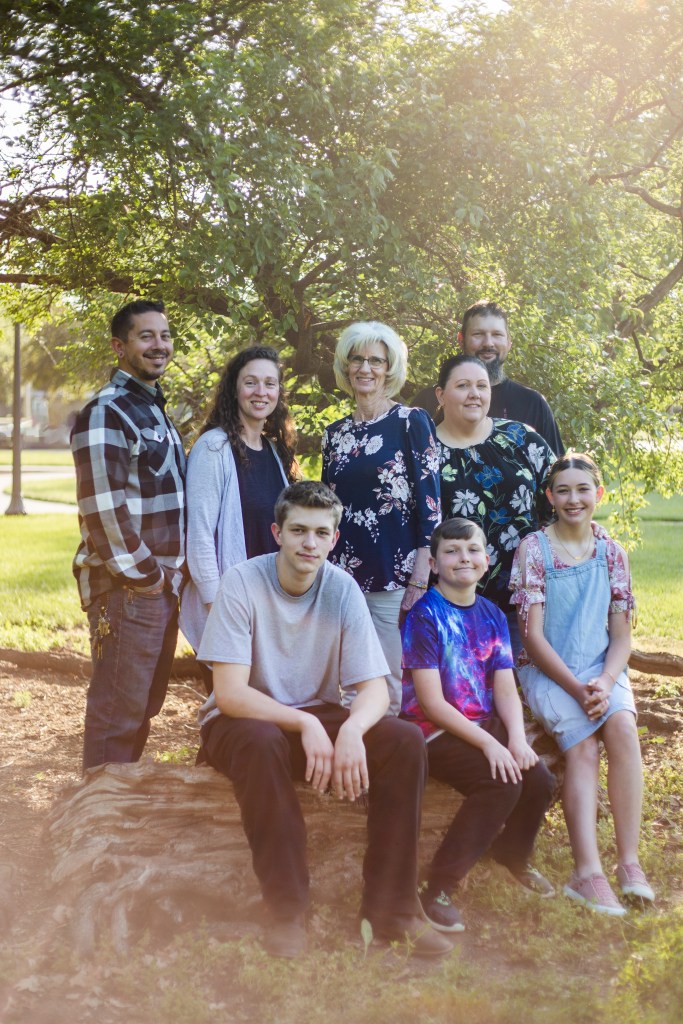 Family smiling during mini session in Oakdale park